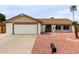 Charming single-story home with a two-car garage and desert landscaping at 16010 N 47Th Dr, Glendale, AZ 85306