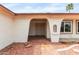Inviting front porch featuring an arched entryway and desert-style landscaping at 16010 N 47Th Dr, Glendale, AZ 85306