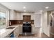 Modern kitchen with granite counters and stainless steel appliances for convenience at 16010 N 47Th Dr, Glendale, AZ 85306