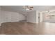 Spacious living room with hardwood floors and multiple ceiling fans offers room to relax at 16010 N 47Th Dr, Glendale, AZ 85306