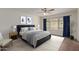 Cozy bedroom with a ceiling fan, bright window, and an inviting color palette at 16010 N 47Th Dr, Glendale, AZ 85306