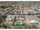 Overhead shot of a home featuring solar panels and a backyard pool and patio area at 18051 W Port Royale Ln, Surprise, AZ 85388