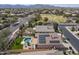 Lovely aerial view of a home with solar panels, pool and patio area in a well-kept backyard at 18051 W Port Royale Ln, Surprise, AZ 85388