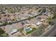 Bird's-eye view of a residential area, highlighting a home with solar panels and a private pool at 18051 W Port Royale Ln, Surprise, AZ 85388