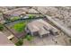 Expansive home featuring a lush backyard, pool, four-car garage, and desert landscaping at 18159 W Piro St, Goodyear, AZ 85338