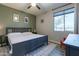 Tranquil bedroom with a comfortable bed, decorative artwork, and a neutral color scheme at 18159 W Piro St, Goodyear, AZ 85338