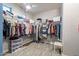 The walk-in closet provides ample storage with built-in shelves and clothing racks at 18159 W Piro St, Goodyear, AZ 85338