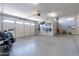 Spacious three car garage featuring epoxied flooring and ample storage at 18159 W Piro St, Goodyear, AZ 85338