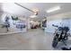 Spacious three car garage featuring epoxied flooring and ample storage at 18159 W Piro St, Goodyear, AZ 85338