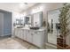 This well-lit main bathroom offers double sinks, great fixtures, and plenty of space at 18159 W Piro St, Goodyear, AZ 85338