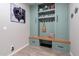 This mudroom features custom cabinets, a bench, and storage drawers, perfect for organization at 18159 W Piro St, Goodyear, AZ 85338