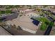 Back exterior of home with solar panels, lush garden, and view of neighborhood at 18159 W Piro St, Goodyear, AZ 85338