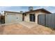 Fenced backyard with a covered patio area and storage shed at 1818 S Toltec --, Mesa, AZ 85204