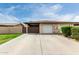 Charming townhome featuring a single-car garage and low-maintenance desert landscaping with a concrete driveway at 1818 S Toltec --, Mesa, AZ 85204