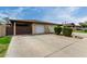 Inviting townhome featuring a single-car garage, low maintenance landscaping, and concrete driveway at 1818 S Toltec --, Mesa, AZ 85204