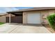 Single car garage with a quaint driveway and fenced courtyard for added privacy at 1818 S Toltec --, Mesa, AZ 85204