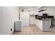 Bright eat-in kitchen with ample counter space, white cabinets, and neutral flooring at 1818 S Toltec --, Mesa, AZ 85204