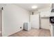 Bright, well-lit kitchen space offering ample storage solutions with white cabinets and tiled flooring at 1818 S Toltec --, Mesa, AZ 85204