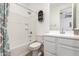 A bathroom with a shower-tub combo and a single sink vanity, complemented by neutral tones at 18956 W Laurel Ln, Surprise, AZ 85388