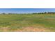 Vast community field, ideal for recreation and outdoor activities at 18956 W Laurel Ln, Surprise, AZ 85388