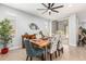 Stylish dining room with unique table setting and plenty of natural light at 18956 W Laurel Ln, Surprise, AZ 85388