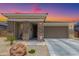 Charming home featuring a low maintenance yard, neutral colors, and a two car garage at 18956 W Laurel Ln, Surprise, AZ 85388