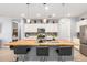 Modern kitchen featuring a wooden island, stainless steel appliances, and pendant lighting at 18956 W Laurel Ln, Surprise, AZ 85388