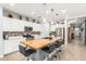 A spacious kitchen boasts a large butcher block island with seating and ample storage at 18956 W Laurel Ln, Surprise, AZ 85388