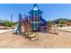 A colorful playground with multiple slides and climbing structures, perfect for entertainment at 18956 W Laurel Ln, Surprise, AZ 85388