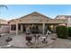 Enjoy the open-air patio for dining or relaxing, surrounded by desert landscaping and a covered area at 2123 S Bristol Dr, Mesa, AZ 85209