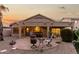 Charming backyard featuring desert landscaping, a brick paver patio, and outdoor seating areas at 2123 S Bristol Dr, Mesa, AZ 85209