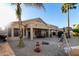 This backyard boasts a charming patio, desert landscape, and cozy covered seating, perfect for outdoor living at 2123 S Bristol Dr, Mesa, AZ 85209