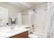 Clean bathroom featuring white tile, a shower/tub combo, and a wood vanity at 2123 S Bristol Dr, Mesa, AZ 85209