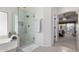 Modern bathroom with glass-enclosed shower and decorative tile flooring at 2123 S Bristol Dr, Mesa, AZ 85209