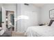 Well-lit bedroom with closet, neutral walls, and attached seating area at 2123 S Bristol Dr, Mesa, AZ 85209