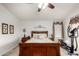 Bright bedroom featuring a comfortable bed, ceiling fan, and warm natural light at 2123 S Bristol Dr, Mesa, AZ 85209
