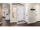 Inviting foyer with wood-look floors, a white front door, and a charming decorative shelf at 2123 S Bristol Dr, Mesa, AZ 85209