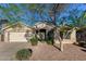 Inviting home with neat landscaping, a two-car garage, and a tiled roof at 2123 S Bristol Dr, Mesa, AZ 85209