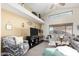 Comfortable living room with high ceilings, modern decor, and large windows for ample natural light at 2123 S Bristol Dr, Mesa, AZ 85209
