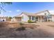 Backyard view featuring a covered patio and ample space for landscaping and outdoor living at 2257 E Lockwood St, Mesa, AZ 85213