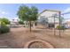 This backyard features a charming fire pit and an elevated deck, perfect for gatherings and relaxation at 2257 E Lockwood St, Mesa, AZ 85213