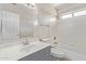 Bathroom featuring white tile, a shower-tub combo, and a gray vanity at 2257 E Lockwood St, Mesa, AZ 85213