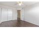 Bedroom featuring wood-look floors, closet and interior door at 2257 E Lockwood St, Mesa, AZ 85213