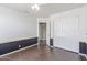 Bedroom featuring wood-look floors, closet and interior door at 2257 E Lockwood St, Mesa, AZ 85213