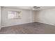 Bedroom featuring hardwood floors, ceiling fan, and window at 2257 E Lockwood St, Mesa, AZ 85213