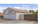 This home features a spacious three-car garage and a private entrance gate enhancing security and convenience at 2257 E Lockwood St, Mesa, AZ 85213