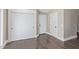 Hallway featuring hardwood floors, a closet with sliding doors and multiple entryways at 2257 E Lockwood St, Mesa, AZ 85213