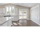 Stylish kitchen featuring white cabinets, granite countertops, and modern stainless steel appliances at 2257 E Lockwood St, Mesa, AZ 85213