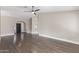 Spacious living room with hardwood floors, archway, and ceiling fan at 2257 E Lockwood St, Mesa, AZ 85213