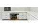 Built-in desk with white drawers and cabinets at 22743 N 97Th Dr, Peoria, AZ 85383